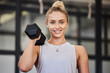 © Joanrae P/peopleimages.com - Woman, dumbbell and gym portrait of a athlete with a smile ready for training, exercise and workout. Sports, happiness and young person bodybuilder in a health, wellness and sport center for body