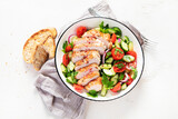 Fototapeta Kawa jest smaczna - Salad with chicken meat. Fresh vegetable salad with chicken breast. Meat salad with chicken fillet and fresh vegetables on plate.