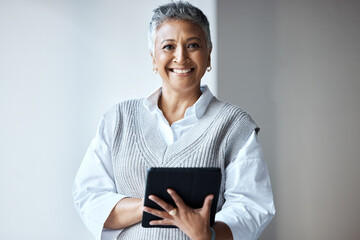 Wall Mural - Tablet, portrait and business woman in the office doing research for a corporate project. Happy, smile and professional senior female employee with a mobile device for company report in the workplace