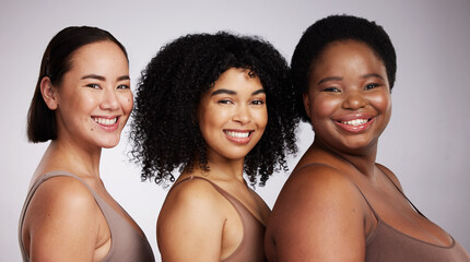 Women, diversity studio portrait and smile for aesthetic, beauty or race equality with plus size solidarity. Model, asian and black woman with cosmetic, makeup and wellness with support for inclusion