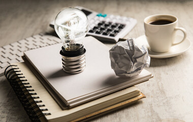 Wall Mural - Notepads and light bulb.