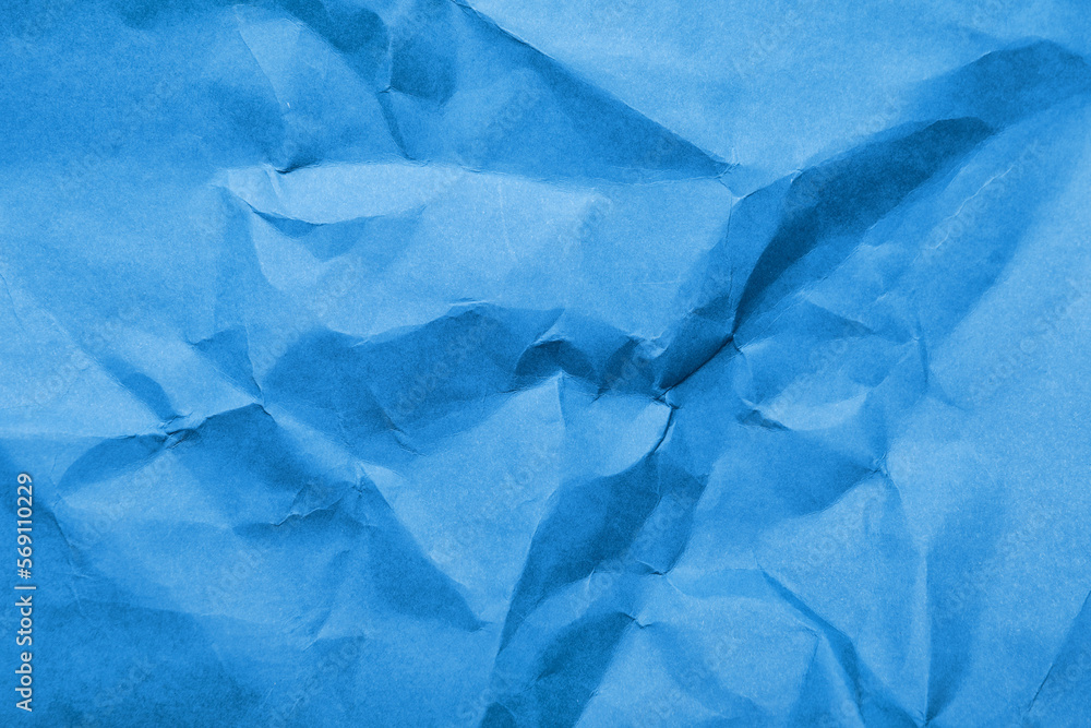 Crumpled blue paper as background
