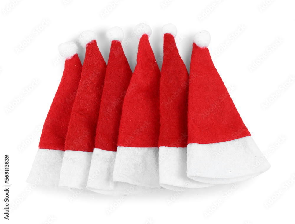Santa hats on white background, top view