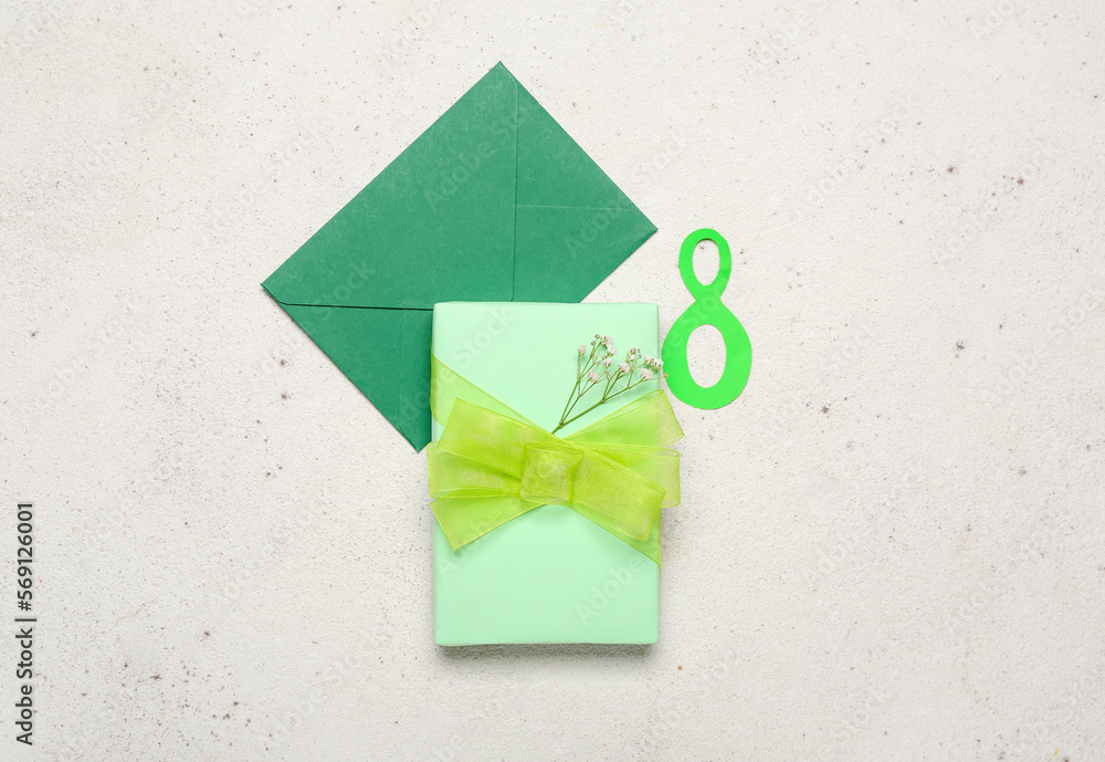 Number 8, envelope and gift for Women's Day celebration on white background