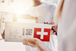 © Courtney/peopleimages.com - Delivery, box and people with QR code for healthcare, package and e commerce courier services. Telehealth supplier giving mail, post or pharmacy shipping to woman for online shopping in supply chain