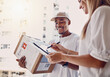 © Courtney/peopleimages.com - Black man, tablet or woman signing for delivery, courier parcel or cardboard box package in house or home. Smile, happy or postal worker technology for customer signature, shipping or logistics order
