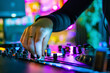 © pavel siamionov - DJ Hands creating and regulating music on dj console mixer in concert nightclub stage
