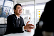 © artitwpd - Professional Asian business adviser meeting to analyze and discuss the strategy of financial support of a tech company. Partnership start-up consultant.