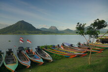 Fishing Boats Anchored At The Jatiluhur Reservoir. Beautiful View Of Jatiluhur Reservoir With Mountains In The Background.