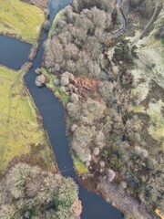 Wall Mural - Aerial view of countryside and farmland with small lakes. Taken in Bury Lancashire. 