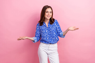Wall Mural - Photo of sweet funny woman dressed blue blouse comparing arms empty space isolated pink color background