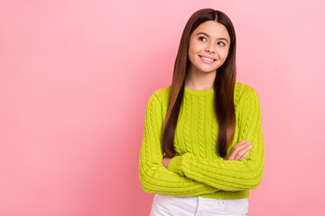 Poster - Portrait of cheerful lovely girl folded arms look empty space beaming smile isolated on pink color background