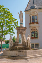 Wall Mural - Schoeneback, Germany - July 24, 2021: Old fountain in the historical downtown, harbor in Schoenebeck, Bad Salzelmen, Salzlandkreis at Elbe River, Germany, at blue summer sky and sunny  day.