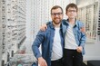 © Serhii - Dad and son choose new stylish glasses in an optical store. Vision care concept
