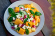 Mint, cucumber, feta, pickled red onions, and fresh cantaloupe melon salad. atop, above, and flat lie. Generative AI