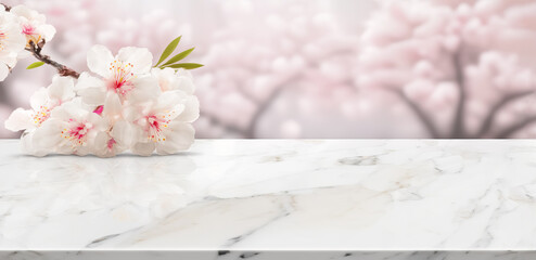 Wall Mural -  White marble stone table top with Sakura cherry blossoms on blur bokeh background. For display or montage you products. Blank space for beauty product display