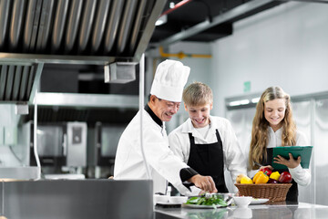 Students are learning to cook in a culinary institute with a standard kitchen and complete equipment. And have a professional chef as a trainer.