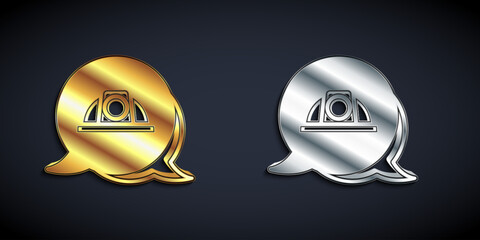 Poster - Gold and silver Worker safety helmet icon isolated on black background. Long shadow style. Vector