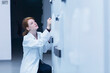 © Cavan Images - Young female engineer controlling a switch gear in control room, Freiburg im Breisgau, Baden-Württemberg, Germany