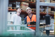 © Cavan Images - Store workers working in a distribution warehouse, Freiburg im Breisgau, Baden-Württemberg, Germany