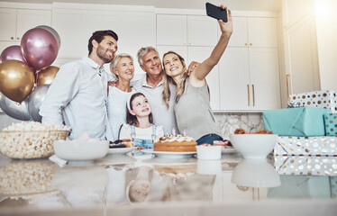 Canvas Print - Birthday party, cake and family selfie in kitchen for happy memory, social media or profile picture. Love, food and girl, mother and grandparents taking pictures or photo together to celebrate event.