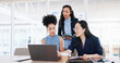 © Coetzee/peopleimages.com - Business women, laptop and collaboration in office for marketing management, leader innovation or strategy research. Team meeting, employee support and tech manager or leadership idea discussion