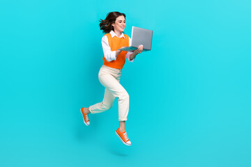 Poster - Full body photo of attractive programmer office worker girl hold netbook order online shopping isolated jump isolated on blue color background