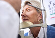 © K Davis/peopleimages.com - Eye exam, vision or laser test for a woman with a machine at optometry consultation for retina problem. Senior, patient or mature client with medical health insurance checking eyesight at optician