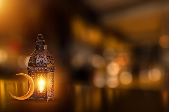 ornamental arabic lantern with burning candle glowing . festive greeting card, invitation for muslim