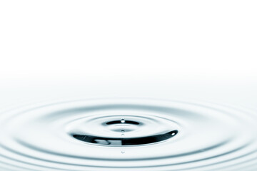 Wall Mural - splash on the surface of the water from a fallen drop