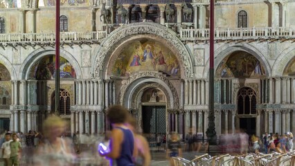 Poster - Entrance to Basilica of St Mark night timelapse. It is cathedral church of Roman Catholic Archdiocese of Venice. It located at Piazza San Marco. Tourists walking in front of it. Venice, Italy