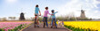 © famveldman - Holland tulip fields. Family on bike. Netherlands.