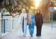 Three women friends going out in Dubai. Girls wearing the united arab emirates traditional abaya