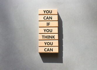 Wall Mural - Motivation symbol. Wooden blocks with words You can if You think You can. Beautiful grey background. Business and motivation concept. Copy space.