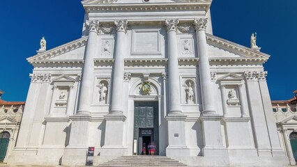 Wall Mural - Facade of Church of San Giorgio Maggiore on the island timelapse hyperlapse. One of the main attractions of Venice front view. Blue sky at summer day.