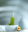Avocado smoothie. Green detox smoothie from avocado on a light blue background. Selective focus. 