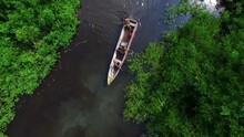 Aerial View Amazon Natives On Boat In River And Jungle