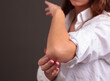 Woman with Elbow Pain. Pain relief concept
