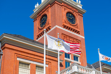 Flag of Rhode Island State in front of Warwick City Hall at 3275 Post Road in village of Apponaug, city of Warwick, Rhode Island RI, USA. 