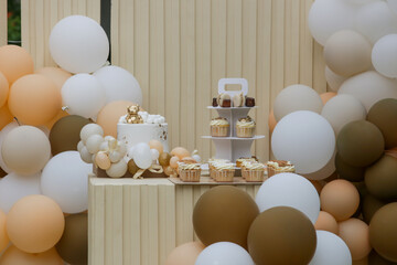 creative gender neutral baby shower or birthday decoration in the garden. bohemian style outdoor eve