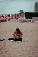 Wall Mural - woman on the beach seat sand miami 