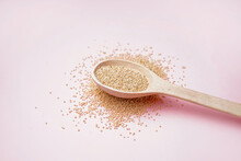 Wooden Spoon With Amaranth On Pink Background
