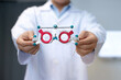 © chomplearn_2001 - Selective focus of optometrist holding trial frame optical equipment for examine the vision