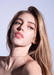 © Volodymyr - Beauty face of young blonde woman. Sexy model posing in studio. Portrait of beautiful girl. Beauty woman face closeup. Pretty girl face on studio background. Sensual look. Beautiful female face.