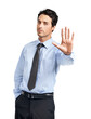 © peopleimages.com - A confident young caucasian businessman showing a stop gesture isolated on a png background.