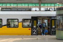Passengers Boarding Polish Electric Regional Train In Wrocław