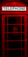 London Red Phone Booth. Britain Red Public Phone Box. Street Style. Front View.