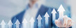 © NicoElNino - Business growth with businessman touching chart with arrows pointing up. Growing revenue and profit. Successful plan or strategy, good sale performance or return on investment.