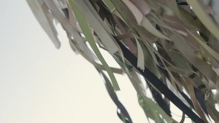 Wall Mural - Ribbons being tied, close up shot, symbolizing peace from war, Jeju island Korea