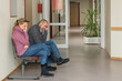 © M.Dörr & M.Frommherz - two patients sitting in the waiting room of a doctor's office